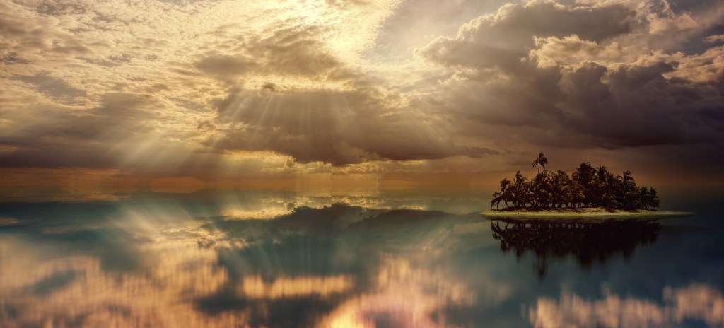 Poetry A small island on far right side in a backdrop of sky clouded with thick shafts of light streaming down and the waters reflecting the sky clear