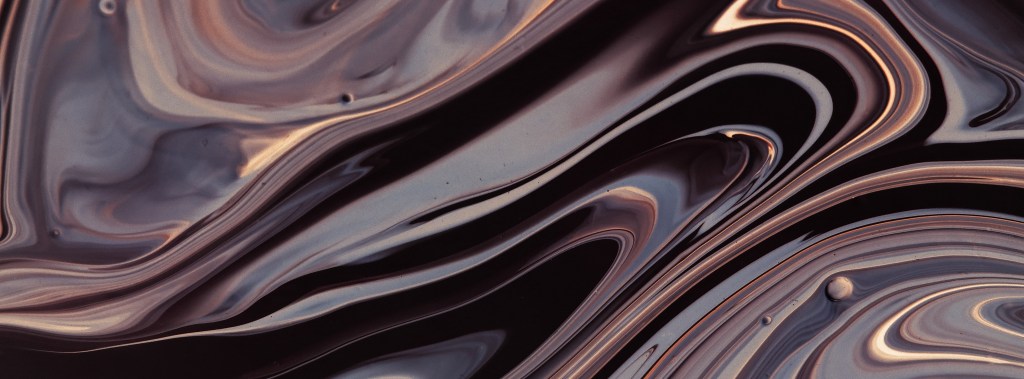 Poetry an abstract art with swirls of metallic silvers and golds