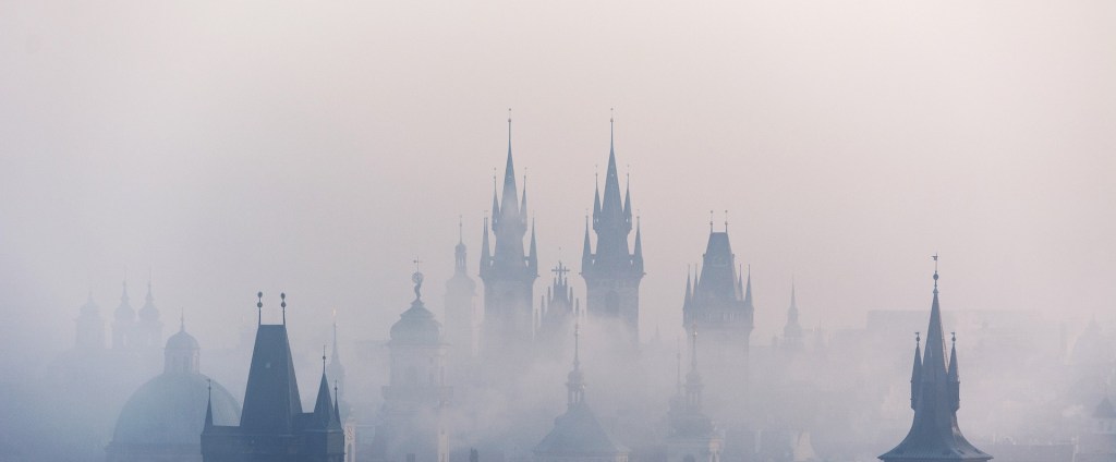 Poetry tall spires of buildings risings from thick mist of the past or future?
