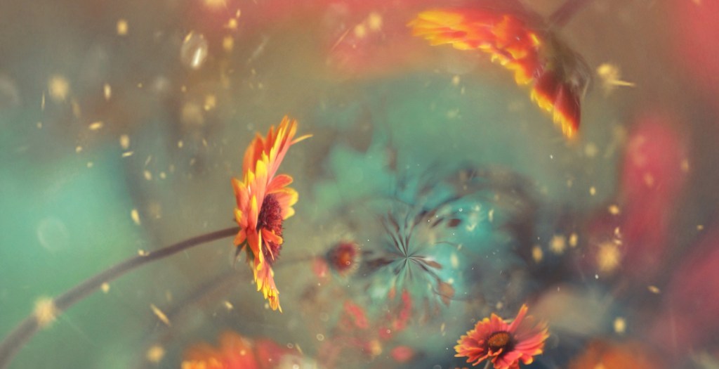 Poetry abstract are with colors nebulizing from the center with sunflowers facing that center