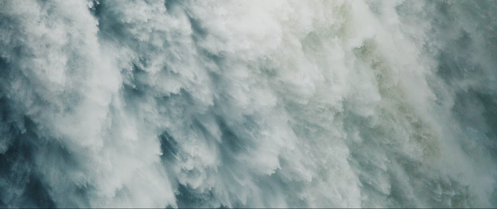 Poetry water cascading and gushing down